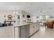 Open kitchen boasts a large island with stainless steel dishwasher and pendant lighting at 4344 Eldron Ave, North Port, FL 34286