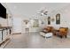 Inviting living room features tiled floors, bright natural light, and neutral decor, creating a comfortable space at 4344 Eldron Ave, North Port, FL 34286