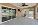 Screened patio with sliding glass doors and access to a hot tub at 4344 Eldron Ave, North Port, FL 34286