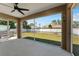 View of the backyard with a hot tub from the screened patio at 4344 Eldron Ave, North Port, FL 34286
