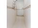 Shower featuring white tile, mosaic accents, a built-in seat, and a shower caddy at 4344 Eldron Ave, North Port, FL 34286