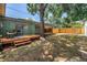 Large backyard featuring a wooden deck, and mature trees for shade at 4730 15Th N Ave, St Petersburg, FL 33713