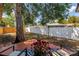 Spacious backyard with a wooden deck, privacy fence, and mature shade trees at 4730 15Th N Ave, St Petersburg, FL 33713