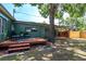 Outdoor living area with a wood deck perfect for enjoying the expansive, fenced backyard at 4730 15Th N Ave, St Petersburg, FL 33713