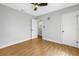 Bright bedroom featuring wood-look floors, a ceiling fan, and neutral decor at 4730 15Th N Ave, St Petersburg, FL 33713