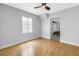 Comfortable bedroom with wood floors and a doorway to the main bedroom at 4730 15Th N Ave, St Petersburg, FL 33713
