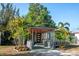 Charming home featuring well-maintained landscaping, colorful foliage and an inviting front porch at 4730 15Th N Ave, St Petersburg, FL 33713