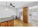 Bright kitchen nook with wood cabinets, granite counters, and adjacent sunroom access at 4730 15Th N Ave, St Petersburg, FL 33713