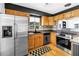 Modern kitchen showcasing stainless steel appliances, wood cabinetry, and black and white accents at 4730 15Th N Ave, St Petersburg, FL 33713