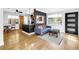 Cozy living room area featuring hardwood floors and bar separating from the kitchen area at 4730 15Th N Ave, St Petersburg, FL 33713