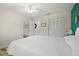 Spacious bedroom with white closet doors and a large bed with a white comforter at 5247 81St N St # 4, St Petersburg, FL 33709