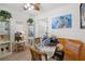 Cozy dining area with a glass table, cushioned bench seating, and decorative accents adding charm at 5247 81St N St # 4, St Petersburg, FL 33709