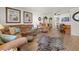 Living room featuring comfortable furniture, a zebra rug, and an open layout connecting to the dining area at 5247 81St N St # 4, St Petersburg, FL 33709