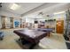 Bright recreational room featuring a pool table, ping pong table, and various posters at 5247 81St N St # 4, St Petersburg, FL 33709