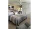 Comfortable bedroom featuring a large bed, closet, and soothing decor at 57 Harbor Way # 24, Palm Harbor, FL 34684