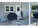Covered carport with storage and stone tile at 57 Harbor Way # 24, Palm Harbor, FL 34684