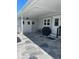 Covered parking area with stylish stone flooring and convenient access to storage at 57 Harbor Way # 24, Palm Harbor, FL 34684
