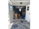 Organized storage room with double doors, providing ample space for tools and equipment at 57 Harbor Way # 24, Palm Harbor, FL 34684