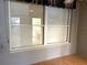 A well-lit window offers a glimpse into the kitchen area of this home, highlighting its practical layout at 5940 30Th S Ave # 206, Gulfport, FL 33707