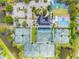 Aerial view of neighborhood amenities, including tennis courts and pool at 6006 Chellas Ct, Lutz, FL 33558