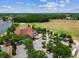 Aerial view of A Tavern at Cheval and parking lot, near golf driving range and lake at 6006 Chellas Ct, Lutz, FL 33558