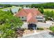 Aerial view of clubhouse with lake view, and golf course at 6006 Chellas Ct, Lutz, FL 33558