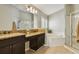 Spacious bathroom boasts dual sinks, a soaking tub, and glass-enclosed shower at 6006 Chellas Ct, Lutz, FL 33558