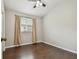 Bedroom features vaulted ceiling, laminate flooring, and natural lighting at 6006 Chellas Ct, Lutz, FL 33558