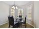 Cozy breakfast nook with shuttered windows and modern lighting at 6006 Chellas Ct, Lutz, FL 33558