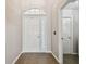 Entryway with a white front door and an arched window above at 6006 Chellas Ct, Lutz, FL 33558