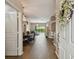 Open foyer view to living spaces featuring tile floors, chandelier, and lots of natural light at 6006 Chellas Ct, Lutz, FL 33558