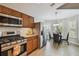 Open kitchen featuring stainless steel appliances, wood cabinets, and breakfast nook at 6006 Chellas Ct, Lutz, FL 33558
