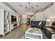 Inviting living room boasts a fireplace, custom shelving, and wood-look tile flooring at 6006 Chellas Ct, Lutz, FL 33558