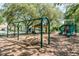 A view of a playground with swings, a picnic shelter, and climbing structures at 6006 Chellas Ct, Lutz, FL 33558
