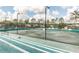 Tennis court with stadium seating and new lights at 6006 Chellas Ct, Lutz, FL 33558