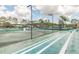 Tennis court with stadium seating and new lights at 6006 Chellas Ct, Lutz, FL 33558