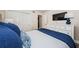 Comfortable bedroom with closet, TV and dresser with nautical lamps at 6265 Sun Blvd # 115, St Petersburg, FL 33715