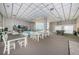 Bright clubhouse featuring ample seating, tables, and recreational games for community enjoyment at 6265 Sun Blvd # 115, St Petersburg, FL 33715