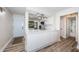 Stylish kitchen featuring white countertops, cabinets and views of the front door and bathroom at 6265 Sun Blvd # 115, St Petersburg, FL 33715