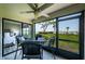 Screened lanai with seating offers seamless indoor-outdoor living and beach views at 6265 Sun Blvd # 115, St Petersburg, FL 33715