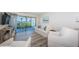 Comfortable living room featuring contemporary decor, wood floors, and beach view at 6265 Sun Blvd # 115, St Petersburg, FL 33715