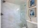 Shower featuring a glass door and marble surround at 6265 Sun Blvd # 115, St Petersburg, FL 33715