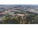 Aerial view displays surrounding community, neighborhood streets and highways at 6652 Simmons Loop, Riverview, FL 33578