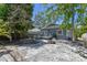 Extensive backyard featuring a paver patio, fire pit, and mature trees at 6939 3Rd N St, St Petersburg, FL 33702