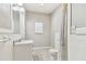 Bright bathroom with marble vanity, tiled floor, and shower with tub at 6939 3Rd N St, St Petersburg, FL 33702