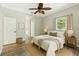 Cozy bedroom with neutral decor, wood floors, and ensuite bath access at 6939 3Rd N St, St Petersburg, FL 33702