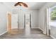 Bedroom boasts light gray walls, gray wood-look flooring, and a ceiling fan at 6939 3Rd N St, St Petersburg, FL 33702