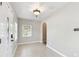 Light-filled foyer with tiled flooring and an arched doorway leading to another room at 6939 3Rd N St, St Petersburg, FL 33702