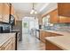 Spacious kitchen with stainless steel appliances and eat-in nook seating at 6939 3Rd N St, St Petersburg, FL 33702