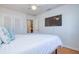 Bright bedroom with a ceiling fan, closet and a wall-mounted TV at 775 S Bayshore Blvd, Safety Harbor, FL 34695